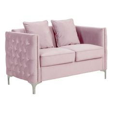 a pink couch with two pillows on it