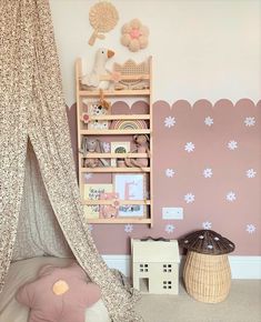 a child's bedroom decorated in pink and white