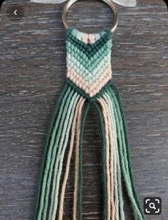 a keychain that has some tassels on it