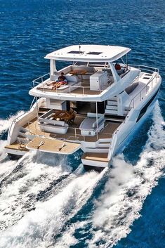 a large white boat traveling through the ocean