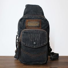 Overview： Design: Blue Denim Mens Cool Sling Bag Chest Bag Vintage Denim Sling Bag For Men In Stock: Ready to Ship (2-4 days)Include: Only BagCustom: NoColor: Dark Blue, BlackLeather:, Denim, Measures: 24cm x 15cm x 10cm Weight: 0.35kgSlots: 1 zipper slot, 1 phone slot, 1 back slot,Accessories(option): NoneStyle: Blue Denim Mens Cool Sling Bag Chest Bag Vintage Denim Sling Bag For MenVery durable (At least 5 Years) and it should last a life time Description: Introducing the Denim Sling Bag: a st Black Denim Travel Shoulder Bag, Black Denim Shoulder Bag For Everyday Use, Black Denim Travel Bag, Casual Black Denim Shoulder Bag, Casual Black Denim Bag, Casual Canvas Chest Bag With Zipper Pocket, Denim Sling Bag, Mens Sling Bag, Overview Design