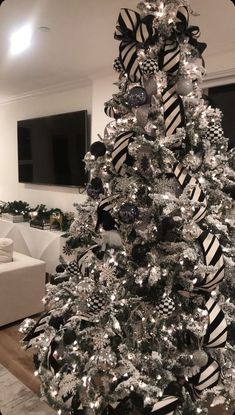 a black and white christmas tree in a living room