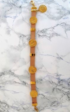 "This is a chunky handmade leather anklet with 24k gold plated embellishments which means they don't tarnish with the sun. It comes in two colors, black & natural tan. It perfectly matches with slip-on sandals, wear it with cropped hemlines all summer long, - Lobster clasp fastening - Adjustable length: 25-28 cm (9.8-11 inches) - Fits most - For a custom size please leave the exact size of your anklet in the box \"note to seller\" when checking out. - You can view all my leather anklets here Luxury Gold Leather Bracelet With Adjustable Fit, Luxury Gold Leather Bracelet Adjustable, Luxury Gold Adjustable Leather Bracelet, Gold Leather Bracelet As Fashion Accessory, Adjustable Gold Leather Bracelet, Adjustable Gold Leather Bracelets, Adjustable Gold Leather Jewelry, Handmade Gold Leather Bracelet, Adjustable Gold Anklet For Festival