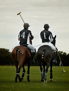 two men on horses playing polo against each other