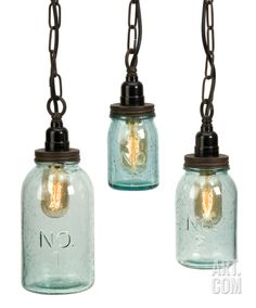 three mason jar lights hanging from chains with no 3 on the top one is light blue