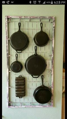 pots and pans are hanging on the wall