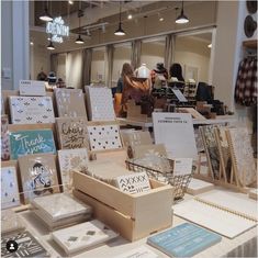 there are many cards on the table in this store that have been set up for sale