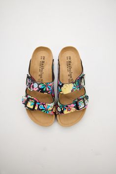 Introducing Maibulun's Signature Double Strap Footbed Sandal in tropical multi floral prints. Designed for ultimate comfort and style, these sandals feature a double strap design for secure support and a hard footbed for extra ankle support. Perfect for a day out or a casual stroll, elevate your look with these signature sandals. 0.59" inch heel Slip-on / buckle closure Hard Cushioned footbed Man-made leather upper Man-made lining EVA sole Reindeer Headband, Footbed Sandals, Ankle Support, Pocket Jacket, Eva Sole, Daily Dress, Dress Jewelry, Strap Design, Metal Buttons