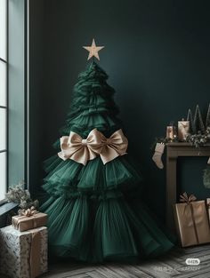 a christmas tree with bows and presents around it