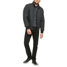 This wool bomber jacket with knit trim is a versatile coat that can be worn anywhere, from the boardroom to a night out on the town. It is a classic style that is sure to impress with its timeless look and sleek fabric. Heading to work or off the clock, keep warm while looking fashionably modern with this versatile bomber coat from Calvin Klein..Medium weight.Sits at waist.Regular fit.Stand collar; Zip-front closure.Single entry hand pockets with zipper closure.Inner channel quilt lining; Metal logo at back neck; Open cuffs with knit rib detail; Seam details at shoulder.Shell: Wool/polyester/nylon/acrylic/other fiber; Body lining: Nylon; Sleeve lining: Polyester.Dry clean only.Imported Winter Business Outerwear With Ribbed Cuffs, Classic Wool Varsity Jacket, Classic Wool Varsity Jacket With Ribbed Collar, Classic Wool Outerwear With Ribbed Collar, Wool Outerwear With Ribbed Collar For Fall, Classic Fitted Varsity Jacket For Winter, Classic Fall Sport Coat With Ribbed Cuffs, Winter Wool Varsity Jacket With Ribbed Collar, Classic Winter Varsity Jacket With Ribbed Cuffs