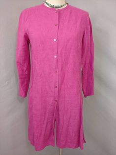 "Soft surface and rich color on this vintage linen tunic shirt jacket. The label is Eileen Fisher, fabric content 100% linen. Photographed un ironed. Natural slightly nubby linen surface, mid weight, color is a wonderful dark magenta pink - not quite as bright/ florescent looking as it photographed. Shape is slim tunic style with a skinny band collar and button front all the way down, deep side slits & long sleeve. Size is marked XS, shown on a 6mannequin, please go by measurements. Machine Casual Linen Long Sleeve Dress With Button Closure, Casual Long Sleeve Linen Dress With Button Closure, Long Sleeve Linen Dress With Buttons For Work, Spring Linen Tunic With Buttons, Spring Linen Tops With Covered Buttons, Relaxed Fit Long Sleeve Linen Dress With Buttons, Long Sleeve Linen Dress With Buttons And Relaxed Fit, Long Sleeve Linen Dress With Button Closure, Single Breasted Long Sleeve Linen Top