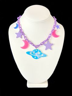 Elevate your look with our space themed chunky charm necklace! Perfect for a one-of-a-kind look and made to last you many festival seasons. - Lightweight acrylic for comfortable wear - Made with a perfect mix of pink, purple, and iridescent charms - Iridescent charms will appear different colors in different lighting - Necklace is adjustable from 16-18" Rave Necklace, Rave Jewelry, Space Necklace, Silly Clothes, Woman In Suit, Festival Necklace, Rave Accessories, Rave Fashion, Concept Clothing