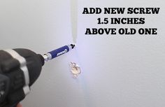 someone using a screwdriver to fix a hole in the wall with text overlay