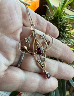 LOVELY and Unique 9k solid yellow gold GARNET Pendant with genuine seed pearls circa 1890 from UK 2 faceted genuine garnets with migrain detailing on the bezels , 6 tiny seed pearls  Vintage 9k solid gold 20" rope chain optional. Contact me if you don't want it...I will deduct $200 from the list price.  3.7grams  Top to bottom approx. 1 3/4"X  1 1/8" " across.   Definitely one-of- a kind  AMAZING craftsmanship...completely handmade...a lost art The Victorian era is generally agreed to stretch through the reign of Queen Victoria (1837-1901). It was a tremendously exciting period when many artistic styles flourished. The beginning of the Victorian era in 1837 also coincided with the beginning of the Romantic Movement, which was a rediscovery of the Renaissance. In the making of the jewelry, Red Oval Victorian Necklace, Vintage Red Garnet Necklace, Antique Red Garnet Necklace, Victorian Garnet Necklace, Antique Hallmarked Garnet Jewelry, Garnet Pendant, Lost Art, Seed Pearl, Rope Chain