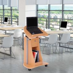 a laptop computer sitting on top of a wooden stand