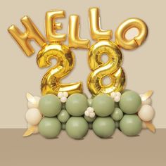 the balloon letters are gold and green with balloons around them that spell out hello - 28