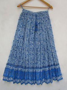 "ITEM DESCRIPTION Indian blue flower printed cotton long maxi skirts - summer season with tassel women long skirts Material: 100% cotton cambric soft crinkled fabric Length: - 38 inch long Waist :-28.00 inch full (14 inch half) 28 inch relaxed can stretch up to 50 inch Size: free size (fit to all) PRODUCT NAME: - Long Women Maxi skirts Ladies Vintage Long skirts Company Return Policy: Please write for more information to my email directly CHOOSE \"ASK SELLER QUESTION \" payment policy:- we accep Blue Boho Print Maxi Skirt, Spring Long Skirt With Tassels, Cotton Ankle-length Maxi Skirt For Summer, Traditional Maxi Skirt For Spring Beach Outings, Long Skirt With Tassels For Spring, Summer Cotton Skirt With Tassels, Flowy Cotton Ankle-length Maxi Skirt, Long Beach Skirt With Tassels, Beach Long Skirt With Tassels