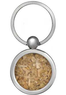 a metal keychain with a cork design on the front and bottom, hanging from an adjustable ring