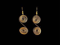 These simple wire earrings are perfect for everyday wear. They come in 2 color variations- gold and silver. Gold Spiral Minimalist Earrings, Elegant Copper Wire Earrings, Minimalist Gold Spiral Earrings, Gold Copper Wire Earrings As Gift, Gold Wire Dangle Earrings, Gold Wire Earrings For Pierced Ears, Gold Copper Wire Earrings For Gift, Minimalist Gold Wire Wrapped Earrings, Handmade Gold Copper Wire Earrings