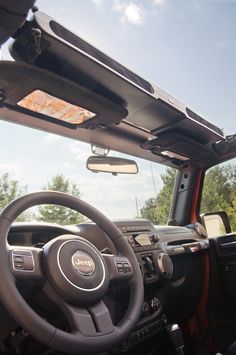 the interior of a vehicle with its dashboard and dash lights on