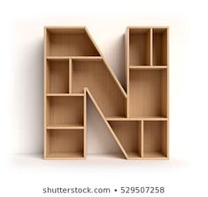 the letter n is made out of wooden shelves and has no one in it yet