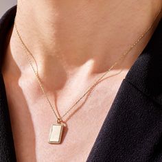 If you have something very special in your mind and want to demonstrate it all the time, our Engravable Pendant, elegantly designed and made with minimalist style, is always here to carry out and reflect your values, with an impeccable pride. - Made in 14k solid gold- Pendant, 17.35x10.25 mm / 0,68x0,40 inches- Thickness, 1.28 mm / 0,05 inches- It can be used with up to 3 mm chains. If you are to use it with a thicker chain, please let us know before you make the purchase. - This product comes w Minimalist Polished Rectangular Pendant Jewelry, Elegant Charm Necklace With Rectangular Pendant For Gift, Elegant Rectangular Pendant Charm Necklace As Gift, Elegant Rectangular Pendant Charm Necklace For Gift, Minimalist 14k Gold Necklace With Square Pendant, Minimalist 14k Gold Square Pendant Necklace, Everyday Necklace With Square Pendant And Polished Finish, Minimalist Rectangular Necklace With Polished Finish, Everyday Square Pendant Necklace With Polished Finish