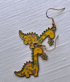 Floral Dinosaur Earrings Cute Dino Earrings for Gift Idea - Etsy Fun Nickel-free Metal Jewelry, Yellow Novelty Earrings With Ear Wire, Novelty Yellow Earrings With Ear Wire, Playful Metal Jewelry For Gifts, Playful Metal Jewelry Gift, Playful Metal Jewelry As A Gift, Playful Yellow Dangle Earrings, Whimsical Gold Metal Earrings, Adjustable Novelty Single Earring Jewelry