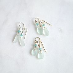 These tiny sea foam frosted glass earrings are so cute and dainty. They're made with recycled glass to resemble sea glass and accented with aqua dyed jade rondelles. They measure 12-16mmx6-11mm in size. **Last pic shows the various shapes. If there's a specific one you want leave me a message in the notes section otherwise they will be chosen randomly. Sea Glass Art Projects, Glass Art Projects, Sea Glass Earrings, Sea Glass Art, Sea Glass Jewelry, Glass Earrings, Beach Jewelry, Recycled Glass, Sea Foam