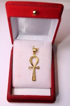 "Egyptian Handmade Ankh Cross Key of Life 18K Yellow Gold Pendant 3 Gr Weight approximate : 3 Gr Height : 1.29\" = 33 mm Width : 0.47\" = 12 mm ✔ IT IS Tested & SIGNED WITH THE EGYPTIAN Gold Government HALLMARK FOR 18K GOLD to Ensure Authenticity. ✔ Lovely gift idea ABSOLUTELY GORGEOUS, LOOKS FABULOUS ON. ✔ 100% Egyptian handmade. ✔ Condition: A brand-new, exactly as on the photos. ★ GIFTS ✔ All items are packaged in a paper jewelry gift box, ready for gifting. ✔ If you are sending a gift di Yellow Gold Ankh Jewelry For Gift, Gold Plated Spiritual Cross Jewelry And Charms, Gold Ankh Cross Necklace Gift, Gold Engraved Ankh Jewelry, Gold Symbolic Crucifix Jewelry And Charms, Yellow Gold Ankh Necklace, Bronze Ankh Necklace, Ankh-shaped Yellow Gold Necklace For Gift, Elegant Ankh-shaped Hallmarked Necklace