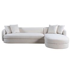 a large white couch with pillows on it's back and the seat upholstered