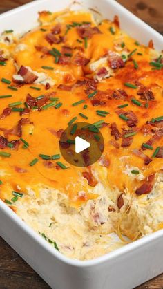 a casserole dish with bacon, cheese and green onions