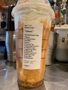 a plastic cup filled with food sitting on top of a counter