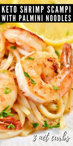 shrimp scamps with pasta on a plate with lemon wedges and parsley