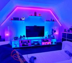 a living room with purple and blue lighting