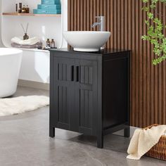 a white sink sitting on top of a wooden cabinet