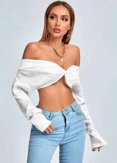 Stay fashionable and feel fabulous in this Twist Front Off Shoulder Long Sleeve Crop Top, crafted with luxurious satin material. This stylish top features an off shoulder neckline with twist front detail for an elegant and eye-catching silhouette. The long sleeves add an extra touch of sophistication, making it perfect for a night out or special occasion. Fabric: Polyester Chic Long Sleeve Twist Front Top, Chic Long Sleeve Top With Twist Front, Chic Cropped Top With Twist Front, Twist Front Long Sleeve Top For Night Out, Long Sleeve Twist Front Top For Night Out, Fitted Twist Front Top For Evening, Elegant Long Sleeve Off-shoulder Party Top, Elegant Long Sleeve Off-shoulder Top For Party, Chic Evening Top With Twist Front