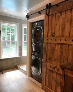 a washer and dryer are in an empty room