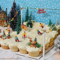 cupcakes decorated with frosting and christmas decorations