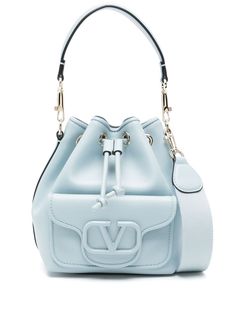 baby blue calf leather single detachable top handle adjustable detachable shoulder strap front patch pocket VLogo Signature main compartment internal patch pocket internal logo stamp leather lining gold-tone hardware top drawstring fastening This piece comes complete with a protective dust bag. Drawstring Top, Chanel 2, Leather Bucket Bag, Leather Bucket, Logo Stamp, Ballet Flat Shoes, Blue Bags, White Bag, Top Shoes