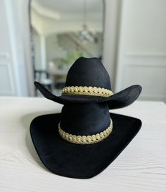 This cowgirl hat is the perfect addition to your western-themed outfit. Made of high quality suede, it only looks great but is also long lasting. Tejana hat type: this hat features a classic tejana design, which adds a touch of authenticity to your western look. Fitted Hat: the fitted styles ensures that this hat stays comfortably in place all day long.  Care Instructions:  to keep this cow girl hat looking its best, simply dry clean it as needed.  Fall accessory must-have: the perfect accessory for fall season for ladies who love the western style fashion. Southwestern Wide Brim Felt Hat For Western-themed Events, Southern Style Fedora For Western-themed Events, Western Style Hat For Rodeo, Southwestern Fitted Hats For Rodeo, Fitted High Crown Felt Hat For Rodeo, Custom Hat Bands For Rodeo, One Size Fits Most, Adjustable High Crown Felt Hat In Country Style, Adjustable Country Style Top Hat For Country Events, Western Felt Hat For Rodeo