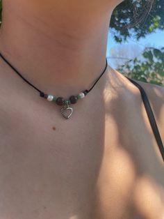 A bohemian choker with green, pearl, brown, and a charm to tie it all together. Made from hemp cord for durability along with clay and glass beads, kept together by a stainless steel clasp.  Choose your charm to match your style! Beaded Brown Choker As Gift, Brown Beaded Choker As Gift, Hippie Choker With Adjustable Cord As Gift, Hippie Choker With Adjustable Cord For Gift, Hippie Style Choker With Adjustable Cord As Gift, Adjustable Beaded Brown Choker, Adjustable Brown Hippie Choker, Adjustable Brown Beaded Choker, Handmade Spiritual Brown Choker