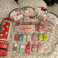 hello kitty items are laid out on a bed