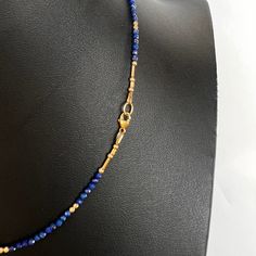 This faceted lapis lazuli and 14K gold bead strand necklace with a lobster clasp is delicate and perfect to add a touch of chic style. Wear alone for a classic look or layer it for your own unique fashion statement. Beaded necklace with faceted lapis lazuli gemstones 14K yellow gold beads + findings Lobster clasp closure shipping : allow up to a week from date your order was placed for shipping Gold Single Strand Lapis Lazuli Beaded Necklace, Elegant Gold Beaded Necklaces With Lapis Lazuli, Gold Lapis Lazuli Faceted Beads Necklace, Gold Lapis Lazuli Necklace With Faceted Beads, Elegant Lapis Lazuli Necklace With Faceted Beads, Elegant Lapis Lazuli Faceted Necklace, Gold Gemstone Necklace, Bead Strand, Strand Necklace