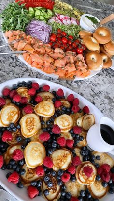 two platters filled with different types of food