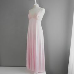 This Is An Absolutely Stunning 'Lily Of France' Vintage Slip-Dress. It Features A Flattering V-Neck Bust, And A Bodice Made Of Soft Lace Material. The Waist Has An Empire Fit Leading Down To A Long Silky Silhouette, With An Elasticized Back. This Slip Is In Impeccable Condition, With No Signs Of Wear (Comes From A Smoke And Animal Free Home). Size - Large (True To Size) Color - Mauve (Pink/Purple Hue) Tag Reads - Lily Of France, Rosa Puleo-Szule Measurements Of Garment Laying On A Flat Surface: -Armpit -Armpit - 17.5" Inches -Length 55.5" Inches (Taken From Top Strap To Bottom Hem) - Open To Reasonable Offers - Pink Gown For Wedding Night, Elegant Pink Slip Dress For Bedtime, Pink Feminine Slip Dress For Night, Sleeveless Pink Wedding Nightgown, Pink Feminine Night Slip Dress, Pink Sheer Sleepwear For Wedding Night, Sheer Pink Nightgown For Night, Pink Lace Trim Slip Dress For Wedding Night, Pink Feminine Nightgown For Wedding Night