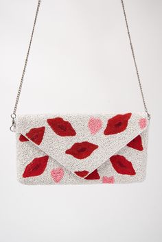 Show the world that you like to have fun with these dazzling beaded lips clutch bags! Express your frisky side while still being fashionable! These bags are ideal for special occasions, but they can also be used on a daily occasion. Perfect for bridal parties, birthday parties, gift giving, special occasions, Valentine's Day, Mother's Day, anniversary gifts, proms, parties, bridesmaids, the mother of the bride, formal parties, and more! Size Length: 10 in (25.4 cm)Width: 5.5 in (13.97 cm)Strap: Unique Clutch Purses, Valentine's Day Evening Clutch Bag, White Envelope Clutch For Party, Glamorous Gift Bag For Valentine's Day, Glamorous Valentine's Day Gift Bag, Trendy Envelope Clutch For Gift, Trendy Envelope Clutch As Gift, White Bags For Valentine's Day Party, White Party Bags For Valentine's Day