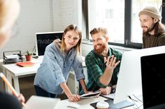 three people in an office having a discussion with each other - stock photo - images