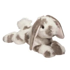 a stuffed bunny rabbit sitting on the ground