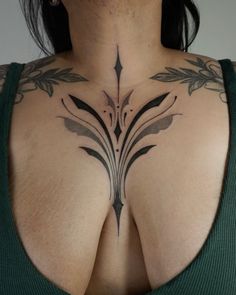 a woman with a tattoo on her chest