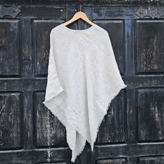 Linen poncho cape, ruana 100% linen Perfect for everyone all year round.  CARE: Hand-wash and hang to dry, light iron if needed, or dry clean. Our linen cape is made from European finest linen. it is extra soft and pleasant to the skin It is  made from Oeko-Tex certified 100 % European linen fabric which guarantees you that it meets human - ecological requirements. MEASURES: Available in two sizes: SHORTER Length at the front of the neckline to the bottom is ~87 cm/34 inches, the shoulder length is ~54cm/21 inches, LONGER Length at the front of the neckline to the bottom is ~115 cm/45 inches, the shoulder length is ~80cm/31 inches, One Size Beige Wrap Shawl, Beige Wrap Shawl One Size, Beige Wrap Shawl, Beige One-size Shawl Wrap, Oversized White Cape Poncho, Beige Shawl Poncho For Beach, Oversized White Poncho Cape, Beach Shawl Poncho, Beige One Size Shawl Poncho